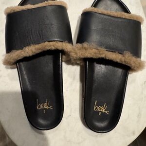 Beek Black Leather Slide Sandals with Tan Shearling Trim